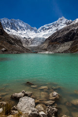 Llaca lagoon in the peruvian Andes and Ocshapalpa peak and Ranrapalca peak