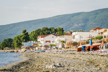 Fototapeta na wymiar Leptokarya, Greece - June 10, 2018: Beach at sea in Leptokarya, Greece