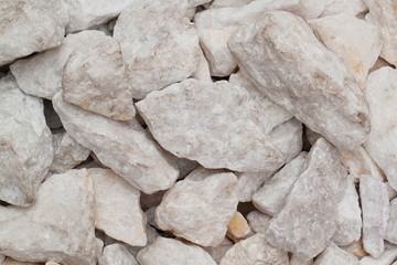 pile of untreated stone in marble or granite of different sizes