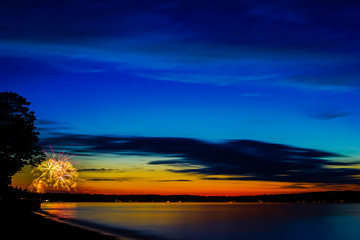 Fototapeta na wymiar Fireworks at sunset