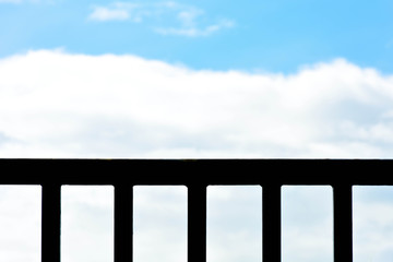 Fototapeta premium silhouette of metal fence with sky