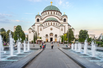 SERBIA, BELGRADE - JULY 04, 2018: View on square with fountains and Saint Sava cathedral - obrazy, fototapety, plakaty