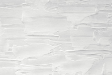 Texture of white paint with a pattern of divorce. Background for various purposes.