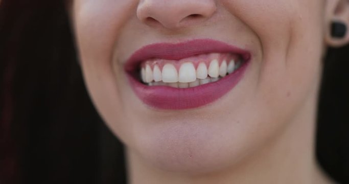 Close-up of hispanic latina girl mouth smile opening and closing mouth to camera showing teeth