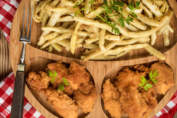 Chicken nuggets with yellow beans.