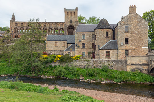 View at ruins of Jedburgh abbey in Scottish borders. In front Jed Water river
