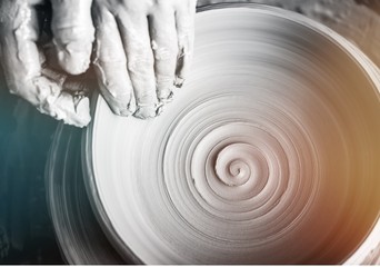 Hand of potter doing clay pot