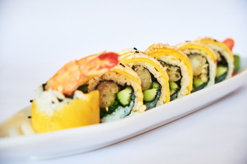 Fusion sushi rolls with shrimp and mango