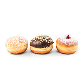 Colorful glazed donuts, top view over white background, isolated