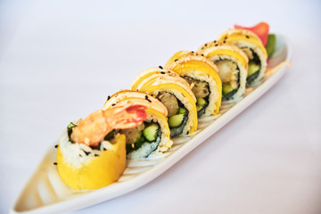 Fusion sushi rolls with shrimp and mango