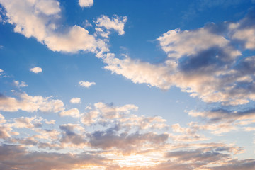 Bright sunny day with clouds. Cloudscape on blue sky. Soft focus.