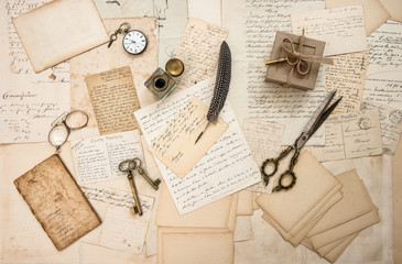 Old letters postcards vintage accessories used paper flat lay