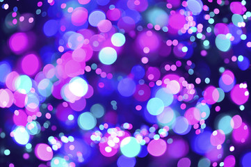 Pink and blue bokeh lights background.	