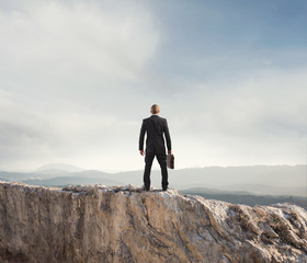 Businessman looks far to the future of the business