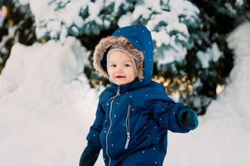 winter. New Year and Christmas holidays. Rest and active pursuits with a happy child in the winter on the snow