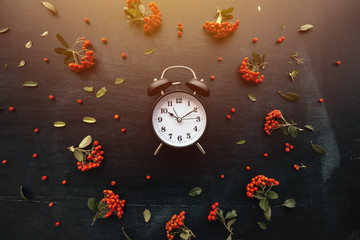 Ten past ten on alarm clock, flat lay