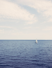 Fototapeta premium Sailing ship on open water ocean calm sea. Matte effect