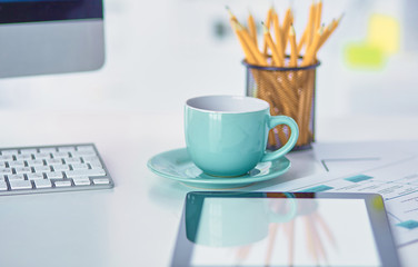 A cup of coffee on the office table