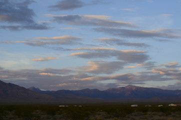 sunrise clouds over mountains in Mojave Desert town Pahrump, Nevada, USA
