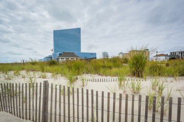 Sand dunes and modern building in Atlantic City, New Jersey.