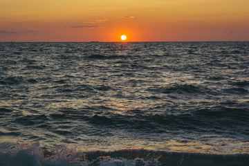 Sunset over the Delaware Bay at Sunset Beach, in Cape May, New Jersey.