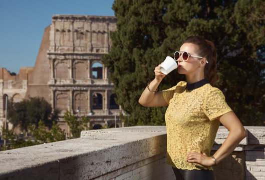 tourist woman not far from Colosseum having coffee