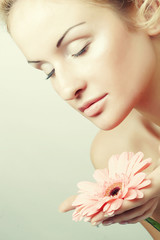 Fototapeta premium young woman with gerber flower