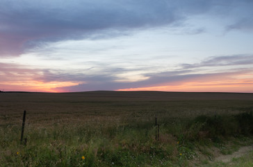 Brilliant Orange, Peach and Blue Sunset with Pasture in the Foreground