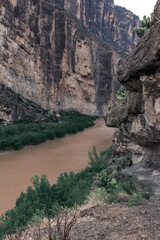 Fototapeta na wymiar The Rio Grande River running between a mountain range splitting the United States and Mexico