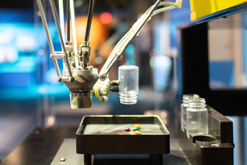 Robot automating pill scanning and sorting