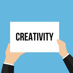 Man showing paper CREATIVITY text