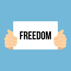 Man showing paper FREEDOM text