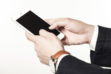 business man hand hold a mobile phone on the white background.