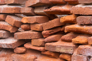 hole in an old brick wall collapsing