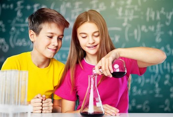 Boy and girl doing chemical experiment