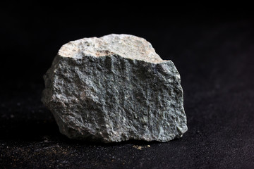 Kaolinite stone isolate on black background
