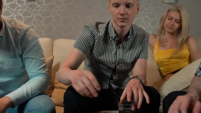 Leisure, games, friendship, gambling and entertainment - Close up of people's hands with playing cards and chips at home. 4k slow motion. Huge rate on river