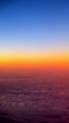 Fototapeta na wymiar Sunset view from airplane window