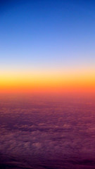 Fototapeta na wymiar Sunset view from airplane window