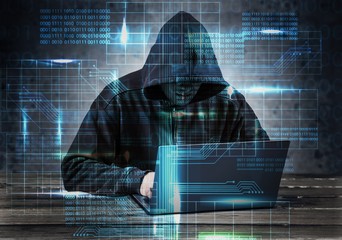 Hacker using laptop. Hacking the Internet