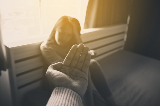 Man giving hand to depressed woman,Suicide prevention,Mental health care concept