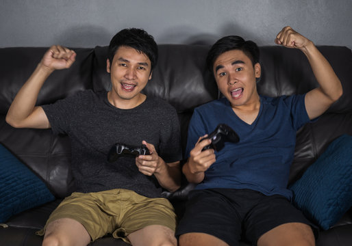 Two Man Playing Video Games And Wins