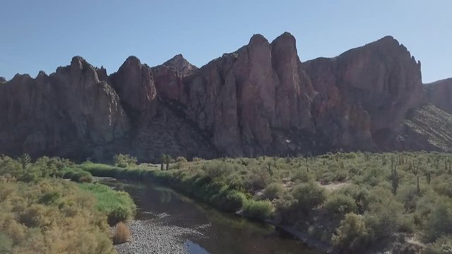 Nice smooth shot of a river at the base of a majestic mountain