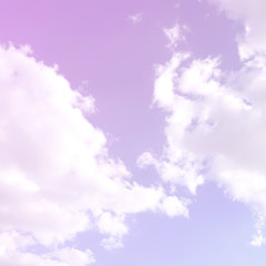 A blue sky with lots of white clouds of different sizes