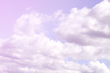 A blue sky with lots of white clouds of different sizes