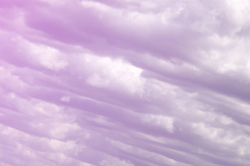 A blue sky with lots of white clouds of different sizes