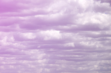 A blue sky with lots of white clouds of different sizes