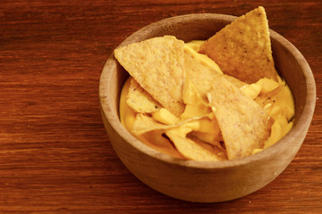 Top view of nachos with cheese dip