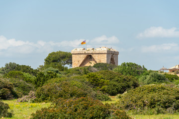 View of the old defense tower of Punta de N'Amer from the time of the Spanish civil war at Sa Coma, on the Spanish Mediterranean island Mallorca