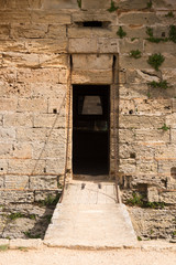 The entrance with a small drawbridge from the old defence tower of Punta de N'Amer near Sa Coma, on the Spanish Balearic Mediterranean island of Mallorca